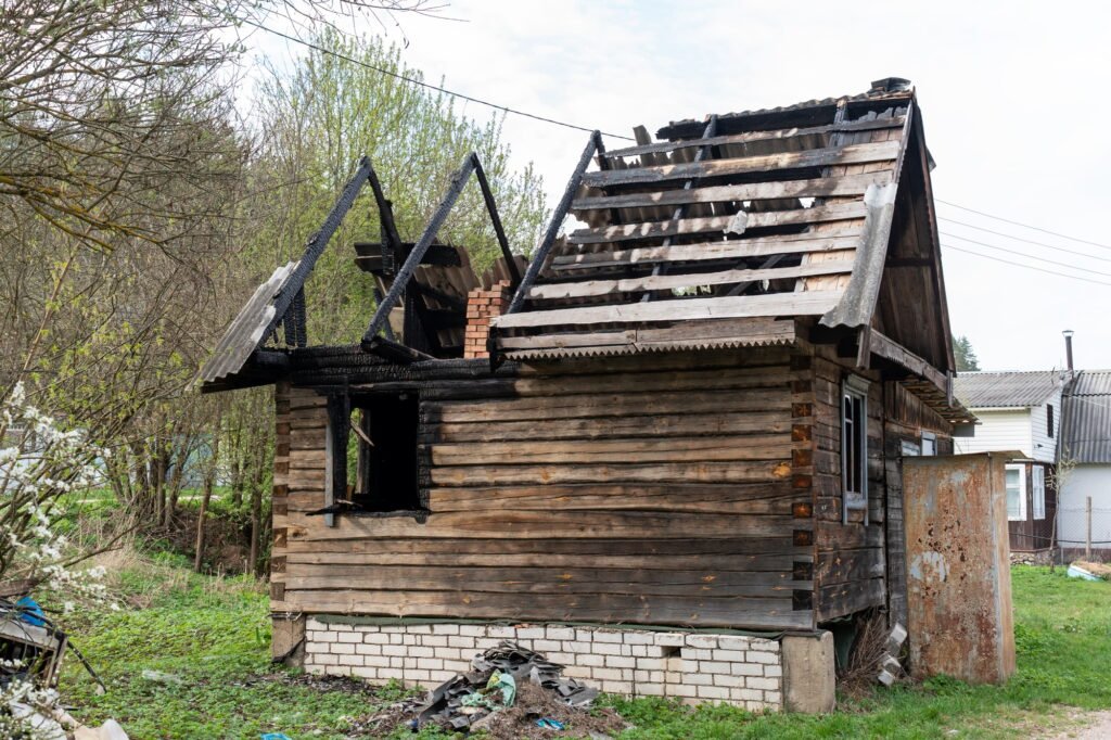 A Fire-Damaged Old Wooden House, a Stark Reminder of the Risks of Unsafe Stove Heating