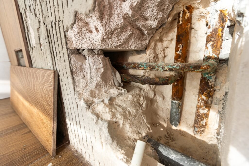 Water damaged wall in an old house. Water damage building interior. wall house broken. Ceiling